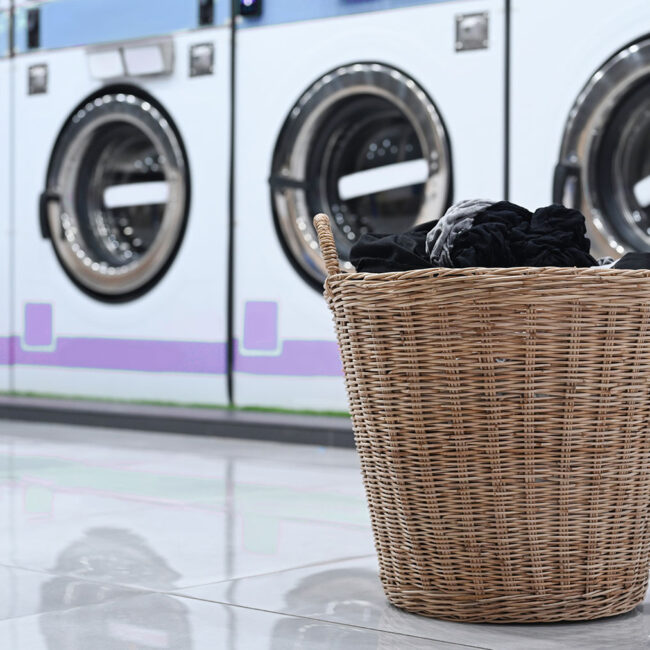 a-basket-of-laundry-and-public-laundromat-2021-09-07-16-33-33-utc